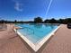 Resort-style pool with ample lounge chairs and umbrellas for a relaxing outdoor experience at 14936 Masthead Landing Cir, Winter Garden, FL 34787