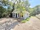 Charming single story home with brick paved drive and palm tree in yard at 1523 S Mellonville Ave, Sanford, FL 32771