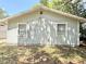 Exterior side of the home showcasing the siding and windows at 1523 S Mellonville Ave, Sanford, FL 32771