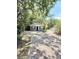 Charming single story home with lush mature trees and brick paved drive at 1523 S Mellonville Ave, Sanford, FL 32771