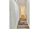 Hallway featuring luxury vinyl plank flooring, linen closet and bathroom entrance at 1523 S Mellonville Ave, Sanford, FL 32771