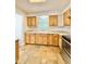 Bright kitchen with wooden cabinets, stone countertops, and stainless steel oven at 1523 S Mellonville Ave, Sanford, FL 32771