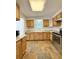 Kitchen featuring wood cabinets, granite countertops, and stainless steel appliances at 1523 S Mellonville Ave, Sanford, FL 32771