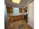 A full kitchen with stainless steel appliances and granite countertops at 1523 S Mellonville Ave, Sanford, FL 32771