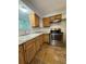 Kitchen with stainless steel appliances, laminate counter tops, and wooden cabinets at 1523 S Mellonville Ave, Sanford, FL 32771