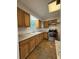 A full kitchen with stainless steel appliances and granite countertops at 1523 S Mellonville Ave, Sanford, FL 32771