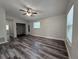 The spacious living room has sleek flooring, neutral paint, and natural light, creating an inviting atmosphere at 1523 S Mellonville Ave, Sanford, FL 32771