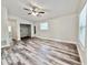 Open-plan living room with new floors, closet and a neutral color scheme at 1523 S Mellonville Ave, Sanford, FL 32771