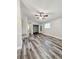 The house has an open living room layout and laminate floors throughout at 1523 S Mellonville Ave, Sanford, FL 32771