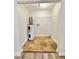 Utility Room with stone flooring, hot water heater and storage shelf at 1523 S Mellonville Ave, Sanford, FL 32771