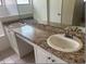Bathroom with double sink vanity, tile floor, and neutral countertops at 1606 Red Clover Ct, Orlando, FL 32825