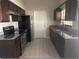 Modern kitchen with stainless steel appliances and granite countertops at 1606 Red Clover Ct, Orlando, FL 32825