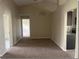 Open-concept living area with vaulted ceilings and seamless flow into kitchen at 1606 Red Clover Ct, Orlando, FL 32825