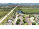 Aerial view of neighborhood near a lake, offering a blend of residential comfort and natural beauty at 1614 Christa Ct, St Cloud, FL 34772
