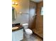 Bathroom with a walk-in shower, granite countertop vanity, and tiled walls at 1614 Christa Ct, St Cloud, FL 34772
