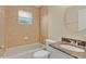 Bathroom featuring shower over tub, tiled walls, and granite countertop at 1614 Christa Ct, St Cloud, FL 34772