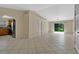 Bright and airy living room with tile floors, ceiling fan, and sliding door to the yard at 1614 Christa Ct, St Cloud, FL 34772