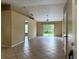 Open living area with tile floors and sliding glass doors to the backyard at 1614 Christa Ct, St Cloud, FL 34772