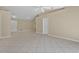 Bright, open living space with tile flooring, multiple entryways, and a neutral color palette at 1614 Christa Ct, St Cloud, FL 34772