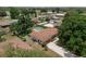 Aerial shot of a home with a backyard pool, shed, and spacious green lawn at 1830 W Clinton Dr, St Cloud, FL 34769