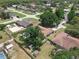 Charming neighborhood home with a spacious backyard featuring a refreshing in-ground pool and mature trees at 1830 W Clinton Dr, St Cloud, FL 34769