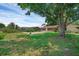 A well-maintained backyard includes a sparkling swimming pool and established trees at 1830 W Clinton Dr, St Cloud, FL 34769