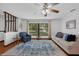 Bright living room with wood floors, a large window, and an open layout perfect for modern living at 1830 W Clinton Dr, St Cloud, FL 34769