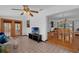 Inviting living room with tile flooring flowing into adjacent dining area with hardwood at 1830 W Clinton Dr, St Cloud, FL 34769