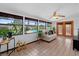 Bright sunroom with tile flooring and views of the backyard pool at 1830 W Clinton Dr, St Cloud, FL 34769