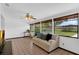 Inviting sunroom with tile flooring, ceiling fan, and backyard views at 1830 W Clinton Dr, St Cloud, FL 34769