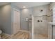 Bathroom boasts a tiled shower with river rock floor, a built-in niche, and a closet at 2113 Kirkland Lake Dr, Auburndale, FL 33823