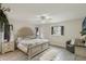 Bedroom boasts wood-look floors, a ceiling fan, and stylish décor for a peaceful retreat at 2113 Kirkland Lake Dr, Auburndale, FL 33823