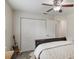 Bedroom featuring light walls, closet space, and a decorative guitar prop at 2113 Kirkland Lake Dr, Auburndale, FL 33823