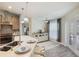 Eat-in kitchen with stainless appliances, island seating, and backyard views through French doors at 2113 Kirkland Lake Dr, Auburndale, FL 33823