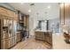 Spacious kitchen featuring modern appliances, ample counter space, and wood cabinets at 2113 Kirkland Lake Dr, Auburndale, FL 33823
