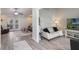 Cozy living room with wood-look tile floors, modern furniture and bright, neutral paint at 2113 Kirkland Lake Dr, Auburndale, FL 33823
