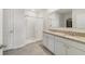 Bright bathroom featuring granite countertops, double sinks, shower, and walk-in closet at 2135 E Old Mill Dr, Deltona, FL 32725
