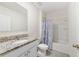 Cozy bathroom featuring a tub and shower combo, granite countertops, and a modern toilet at 2135 E Old Mill Dr, Deltona, FL 32725