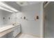 Bright bathroom featuring a spacious countertop, updated fixtures, and a glass-enclosed shower at 216 Bermuda Petrel Ct, Daytona Beach, FL 32119