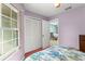 Bedroom featuring a window and closet, seamlessly connected to the dining and kitchen area at 216 Bermuda Petrel Ct, Daytona Beach, FL 32119