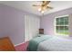 Bedroom with closet and large window providing natural light, perfect for a restful retreat at 216 Bermuda Petrel Ct, Daytona Beach, FL 32119