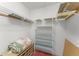 Well-organized closet space with wire shelving and ample storage, next to a padded seat at 216 Bermuda Petrel Ct, Daytona Beach, FL 32119