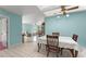 Open dining area with tile floors, seamlessly connecting to the living room creating an inviting space at 216 Bermuda Petrel Ct, Daytona Beach, FL 32119