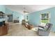 Inviting living room boasting tile floors, comfortable seating, and ample natural light at 216 Bermuda Petrel Ct, Daytona Beach, FL 32119