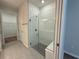Contemporary bathroom featuring a glass-enclosed shower and gray tile at 2322 Daisy Tree Rd, St Cloud, FL 34771