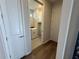 A laundry room with a washer, dryer, and storage cabinets at 2322 Daisy Tree Rd, St Cloud, FL 34771