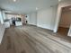 Open concept living room featuring wood flooring, recessed lighting and white trim at 2322 Daisy Tree Rd, St Cloud, FL 34771