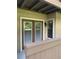 A balcony with a view, featuring a set of double glass doors and a single window at 238 Afton Sq # 106, Altamonte Springs, FL 32714