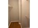 Walk-in closet with built-in wire shelving on wood-look laminate flooring at 238 Afton Sq # 106, Altamonte Springs, FL 32714