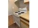Galley kitchen featuring a white electric range and neutral countertops at 238 Afton Sq # 106, Altamonte Springs, FL 32714